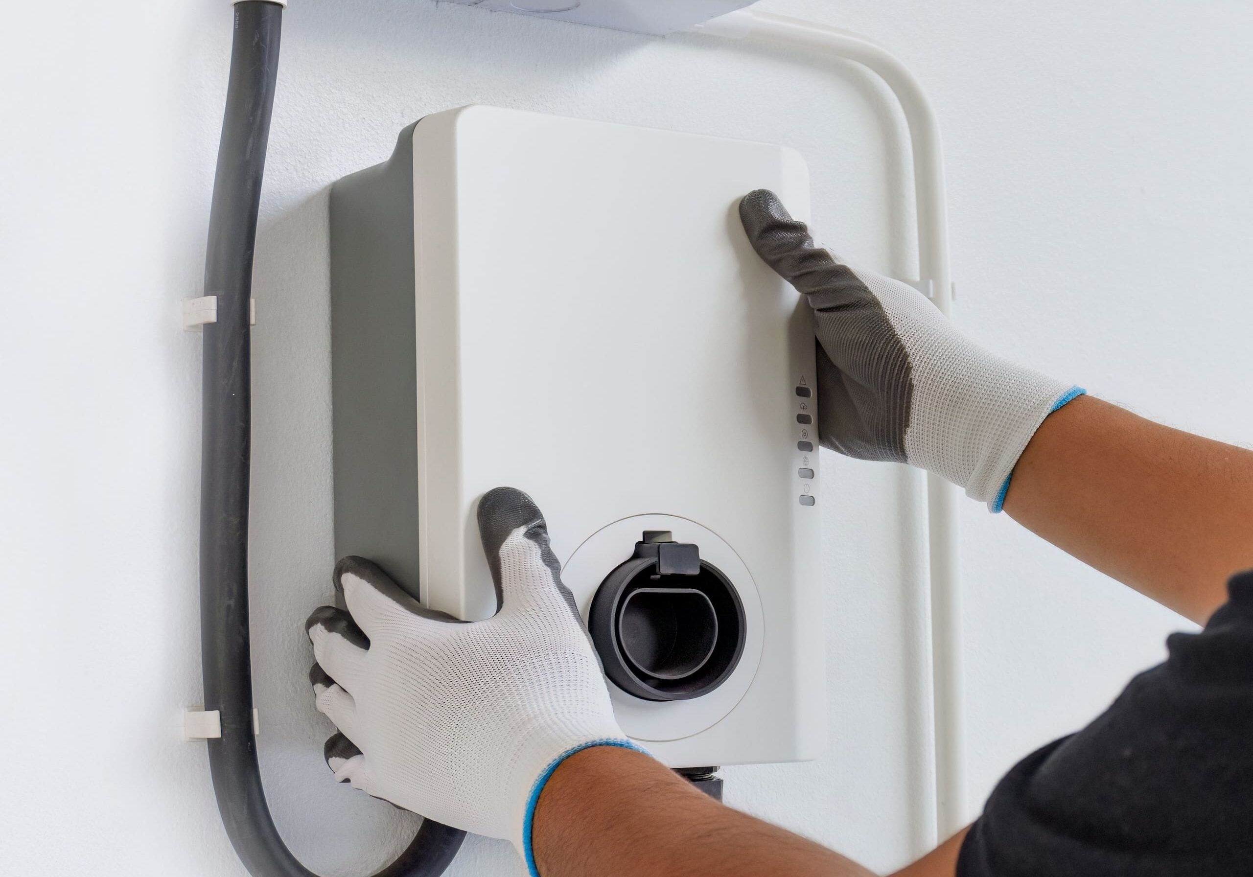 Certified male Electrician Installing Home EV Charger Certified male Electrician Installing Home EV Charger